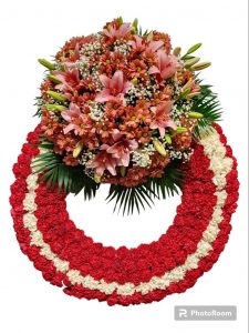 Corona fúnebre con claveles rojos